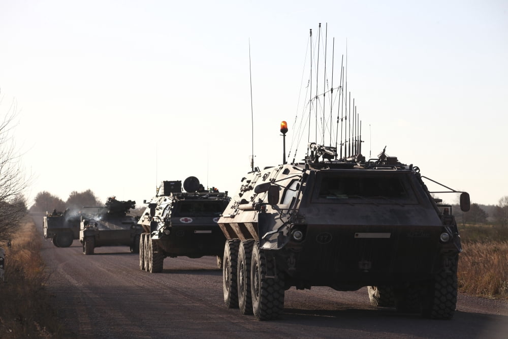 A convoy of German Army TPz Fuchs armored personnel carriers Canvas Art - Timm ZiegenthalerStocktrek Images (35 x 23)