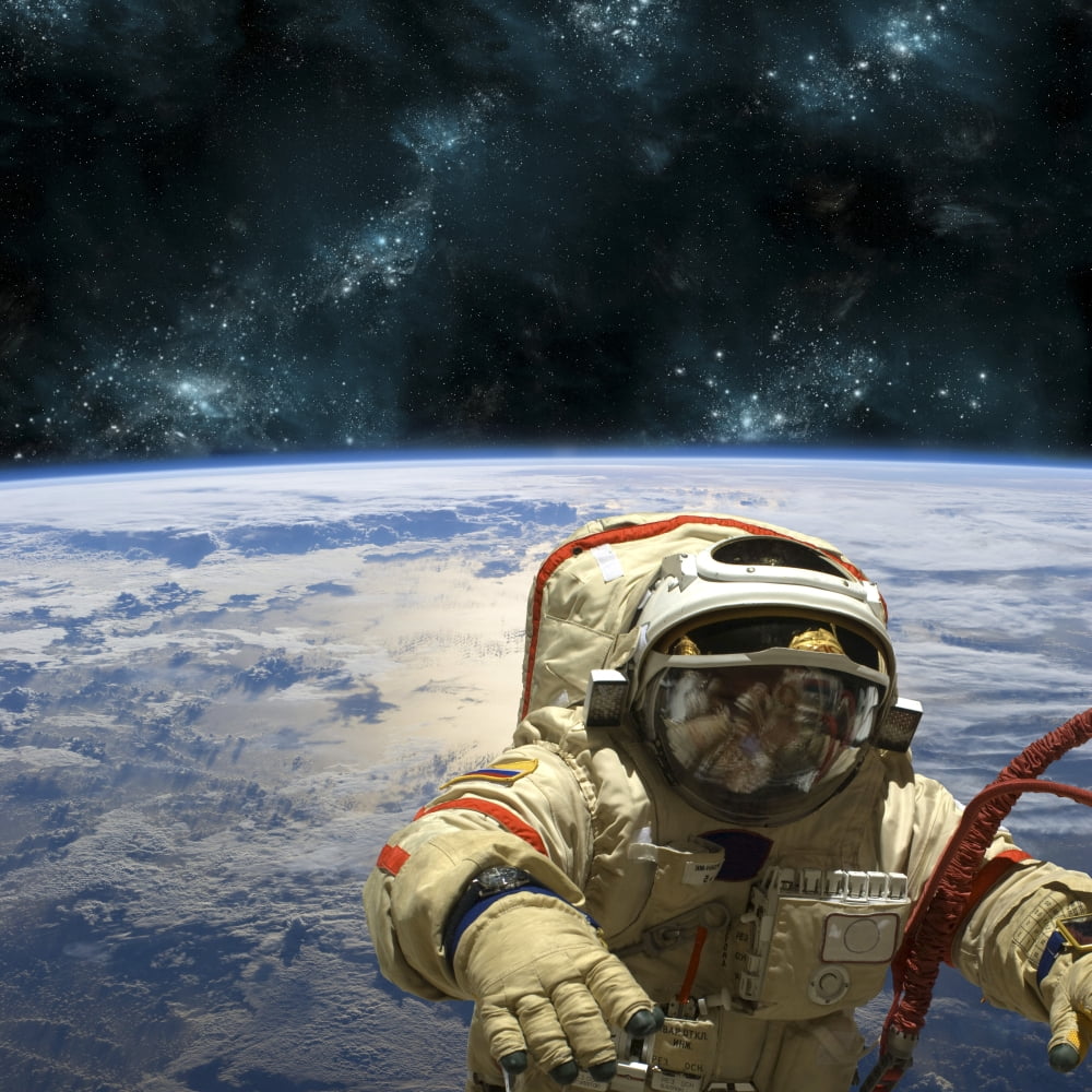 A cosmonaut floats in space above Earth Canvas Art - Marc WardStocktrek Images (29 x 29)