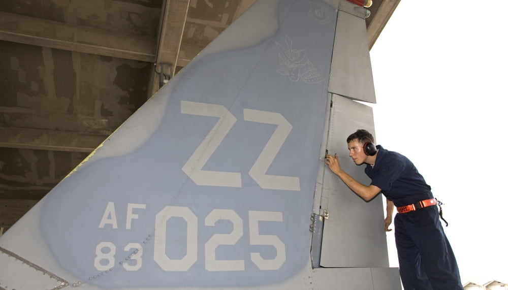 A crew chief conducts postflight inspection on an F-15 Eagle Canvas Art - HIGH-G ProductionsStocktrek Images (38 x 22)
