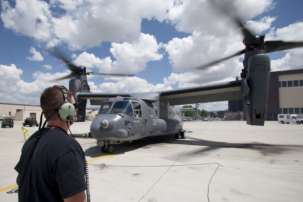 A crew chief watches as a CV-22 Osprey performs preflight checks Canvas Art - HIGH-G ProductionsStocktrek Images (36 x 24)