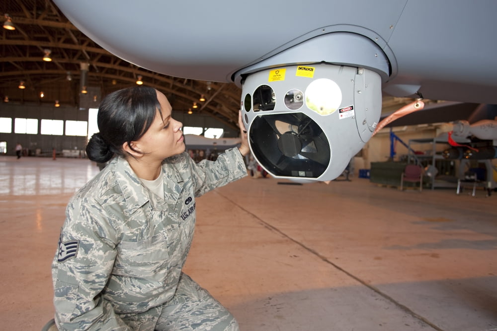 A crew chief works on MQ-9 Reapers MTS-B camera system Canvas Art - HIGH-G ProductionsStocktrek Images (35 x 23)