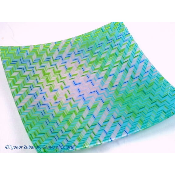 A decorative fused glass plate "Blue Stitches"