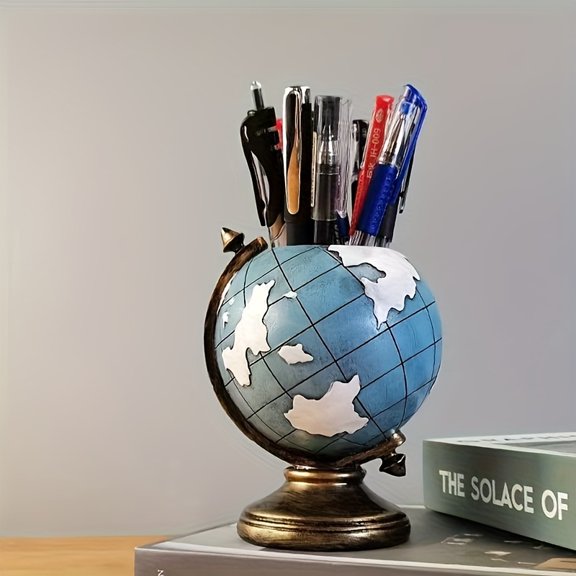 A decorative resin globe pen holder designed for office or living room decor, ideal for gifting to classmates or friends.
