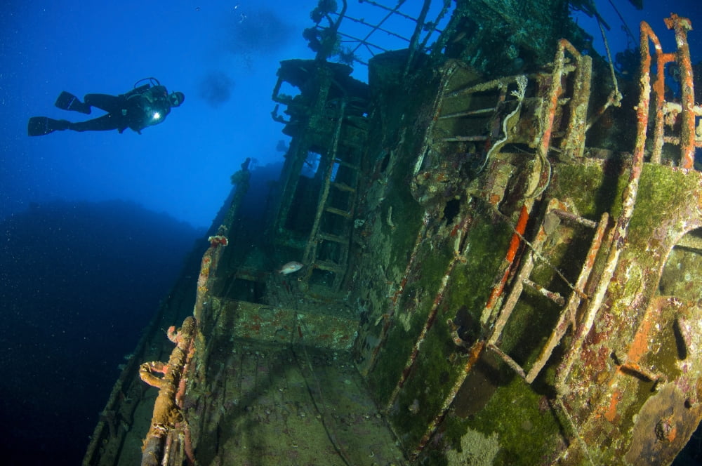 A diver explores the wreck of the Soltai 61 Solomon Islands Canvas Art - Steve JonesStocktrek Images (35 x 23)