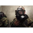 thumbnail image 1 of A field radio operator clears CS gas from his gas mask at the gas chamber Poster Print, 1 of 2