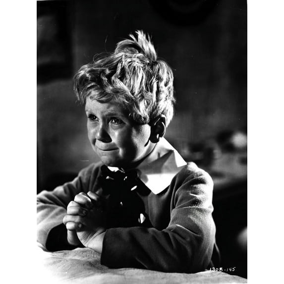 A film still of Jackie Cooper begging Photo Print (24 x 30)