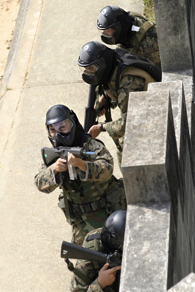 A fire team returns fire from a balcony Canvas Art - Stocktrek Images (23 x 34)