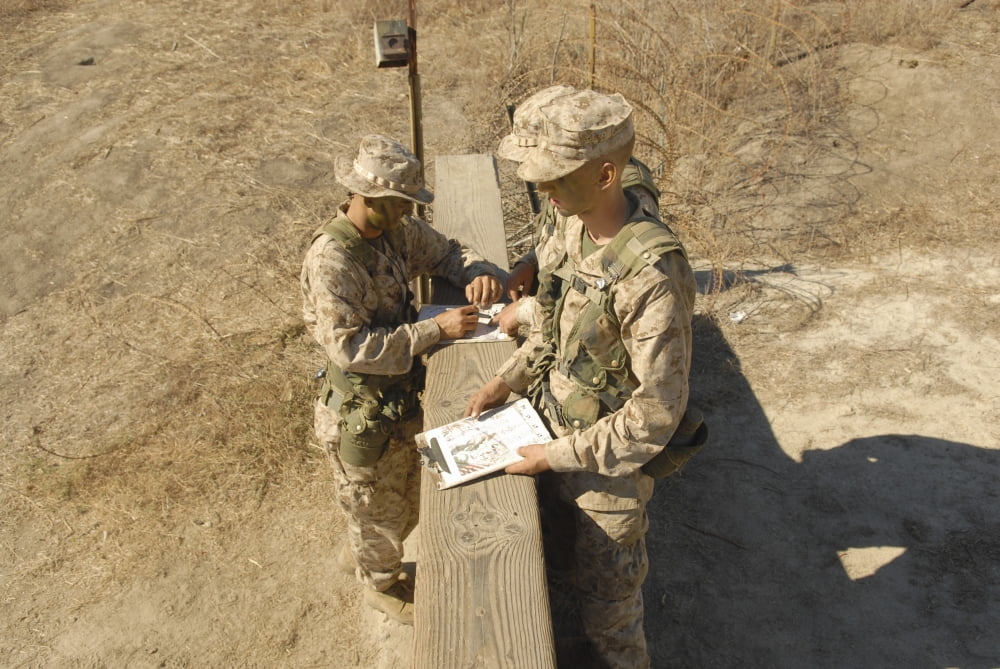 A fire team takes a minute to determine the direction of its next navigation objective Canvas Art - Stocktrek Images (34 x 23)