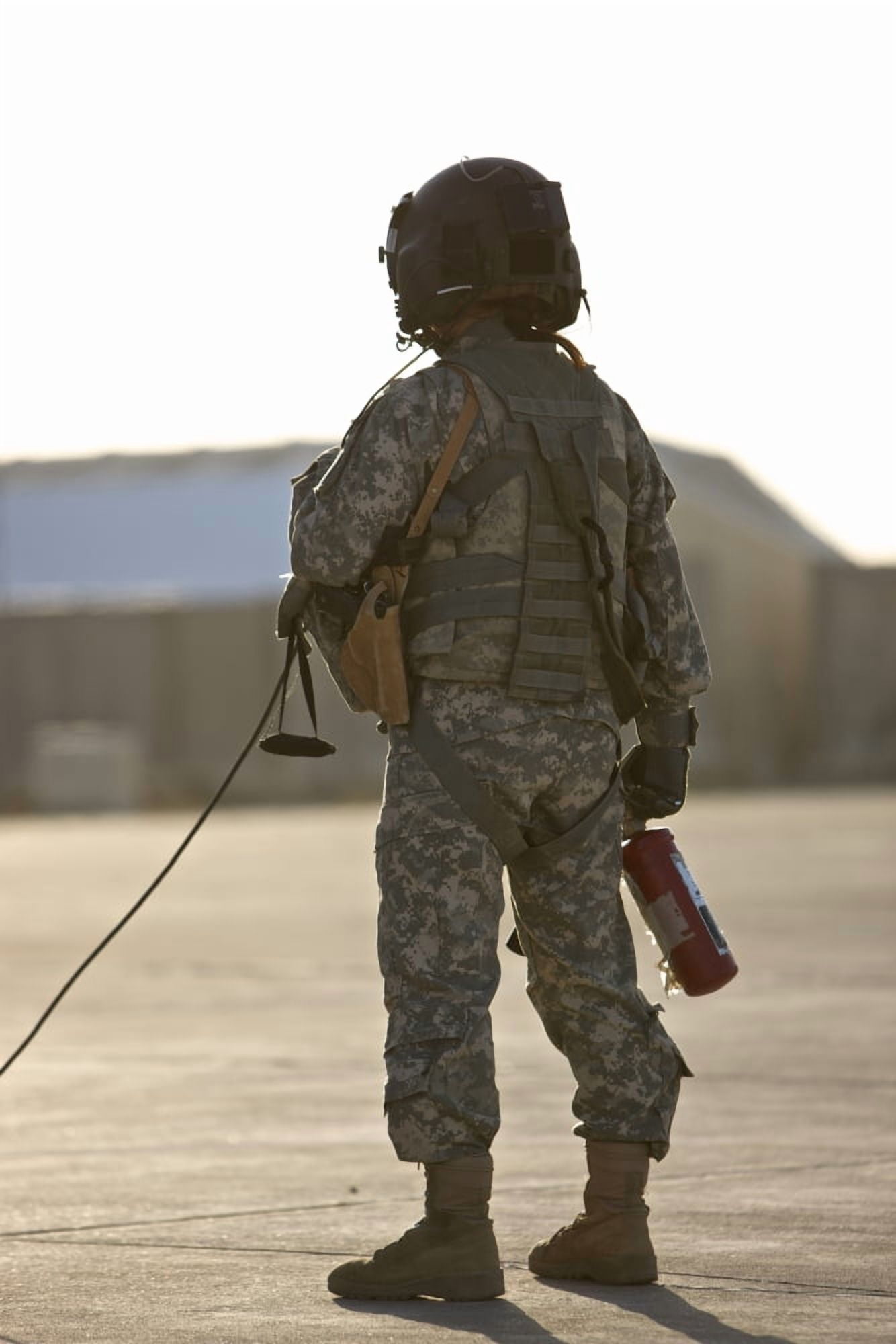 A flight crew member stands by with a fire extinguisher Canvas Art - Terry MooreStocktrek Images (23 x 35)
