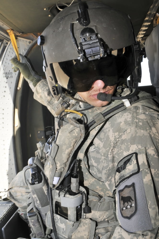 A flight medic conducts a daily pre-flight inspection at Al Asad Air Base Iraq Canvas Art - Stocktrek Images (23 x 35)