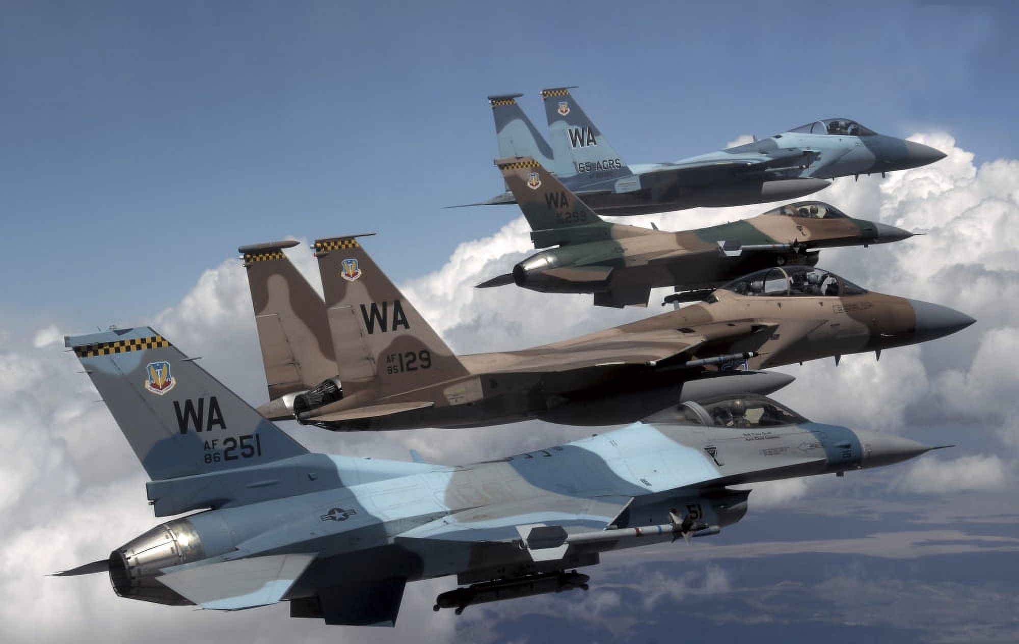 A flight of Aggressor F-15 and F-16 aircraft fly in formation Canvas Art - Stocktrek Images (35 x 22)