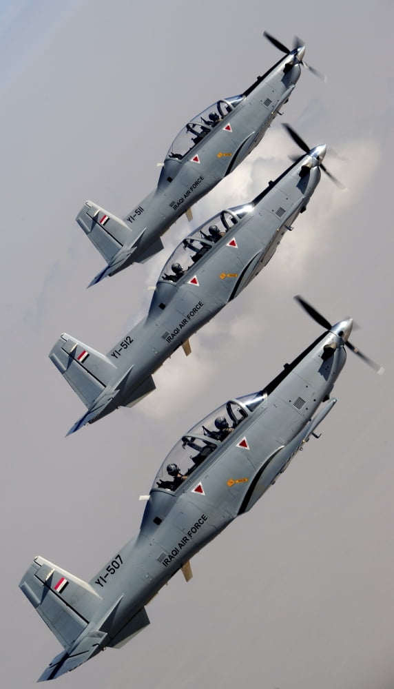 A formation of Iraqi Air Force T-6 Texan trainer aircraft over Tikrit Iraq Canvas Art - Stocktrek Images (22 x 37)