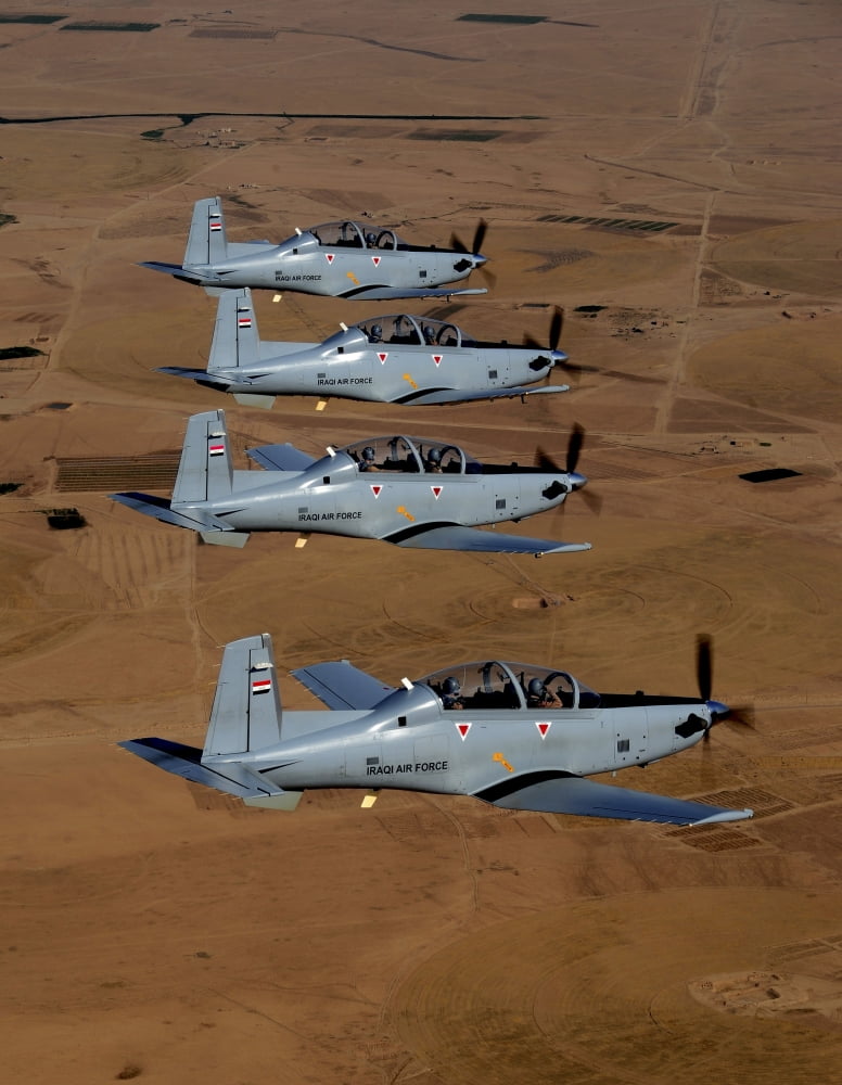A formation of Iraqi Air Force T-6 Texan trainer aircraft over Tikrit Iraq Canvas Art - Stocktrek Images (25 x 33)
