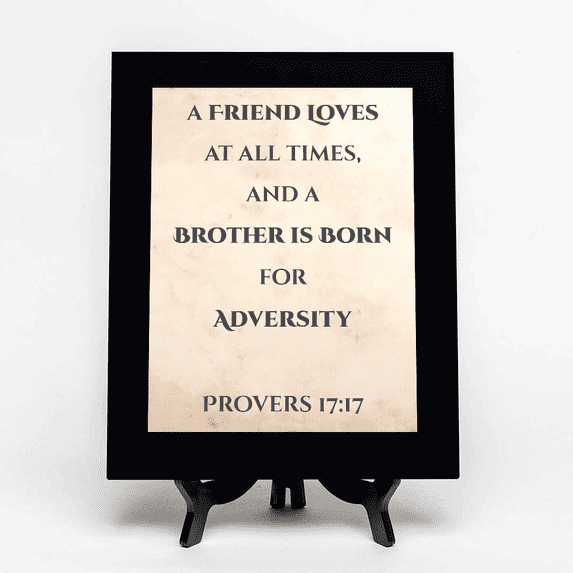 A friend loves at all times, and a brother is born for adversity. Proverbs 17:17, Black Frame 9x12 Decorative Wall Plaque | Elegant Bible Verse