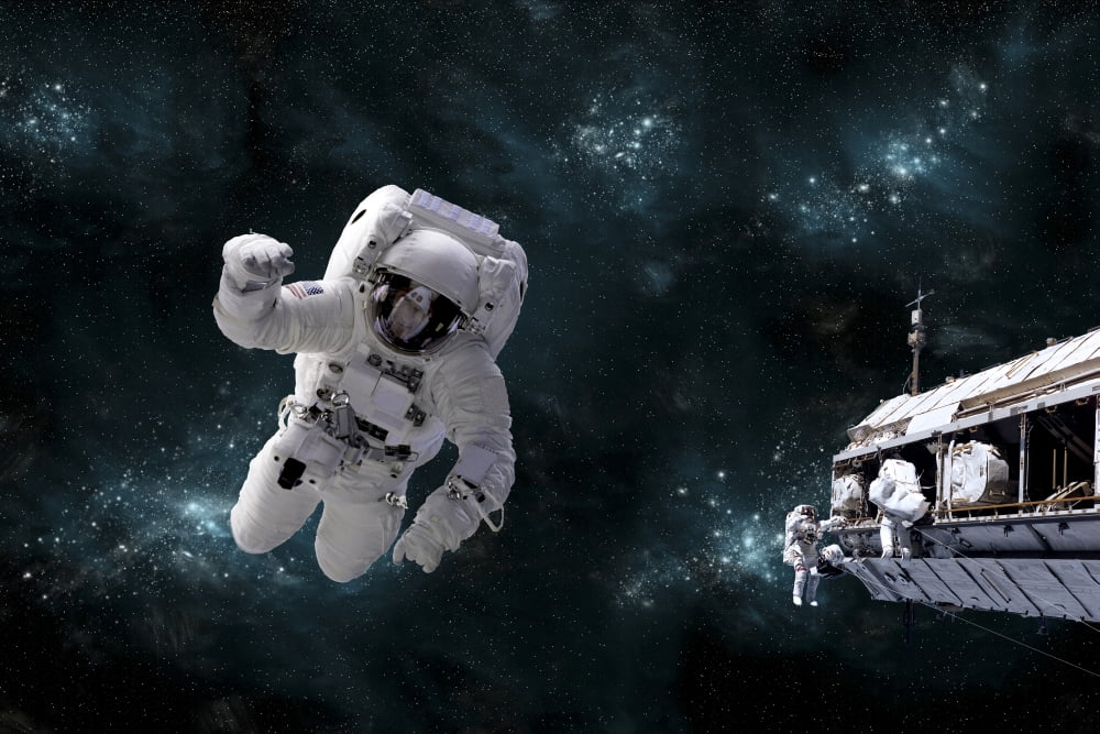 A galactic scene showing astronauts working on space station Canvas Art - Marc WardStocktrek Images (18 x 12)