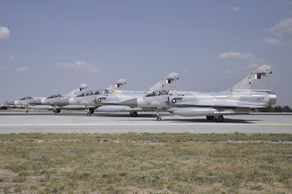 A group of Dassault Mirage 2000-5EDADDA of the Qatar Emiri Air Force Canvas Art - Giorgio CiariniStocktrek Images (34 x 23)