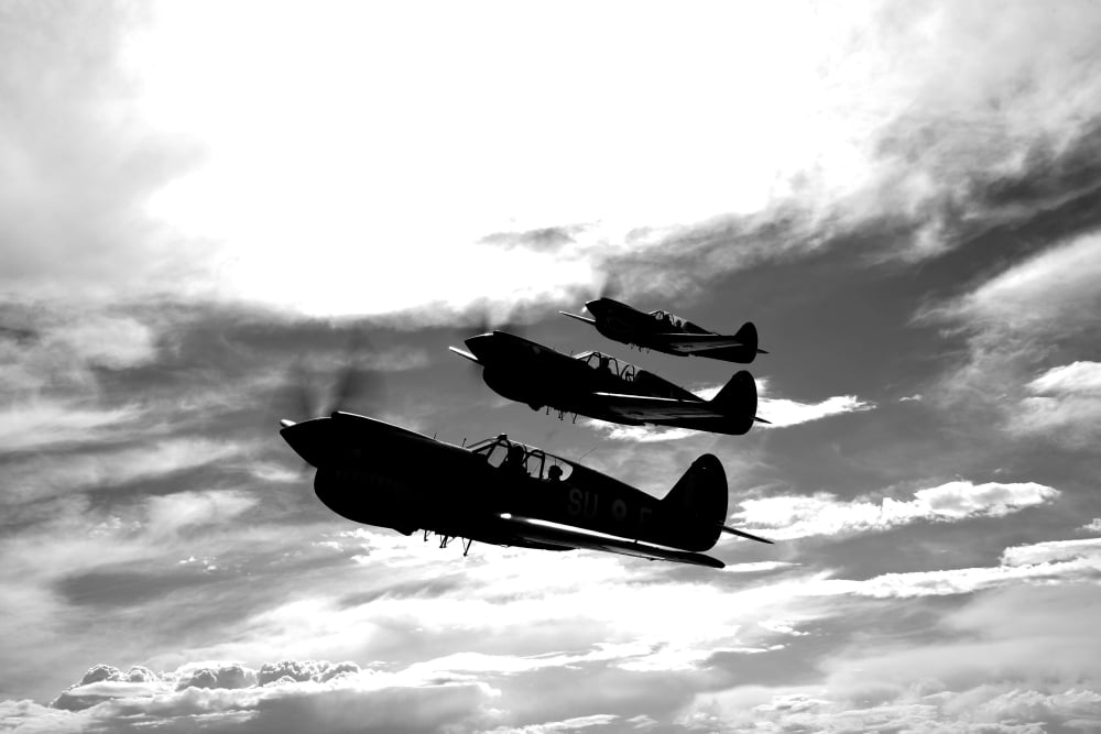 A group of P-40 Warhawks fly in formation near Nampa Idaho Canvas Art - Scott GermainStocktrek Images (18 x 12)