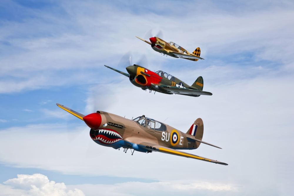 A group of P-40 Warhawks fly in formation near Nampa Idaho Canvas Art - Scott GermainStocktrek Images (35 x 23)