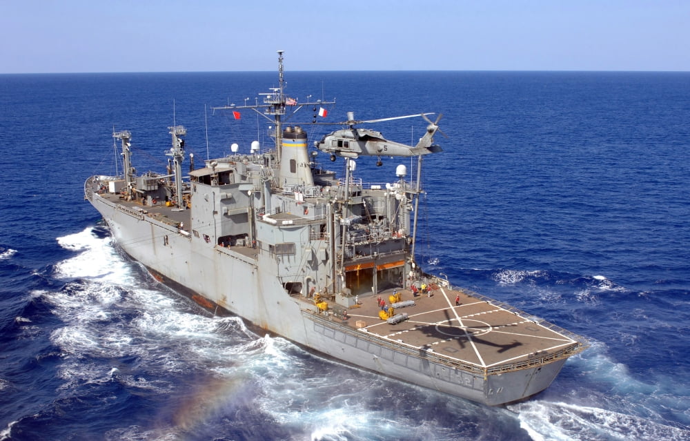 A helicopter clears the flight deck of the Military Sealift Command ammunition ship USNS Flint Canvas Art - Stocktrek Images (35 x 22)