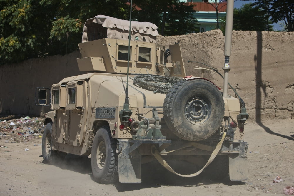 A humvee patrols the streets of Kunduz Afghanistan Canvas Art - Terry MooreStocktrek Images (35 x 24)