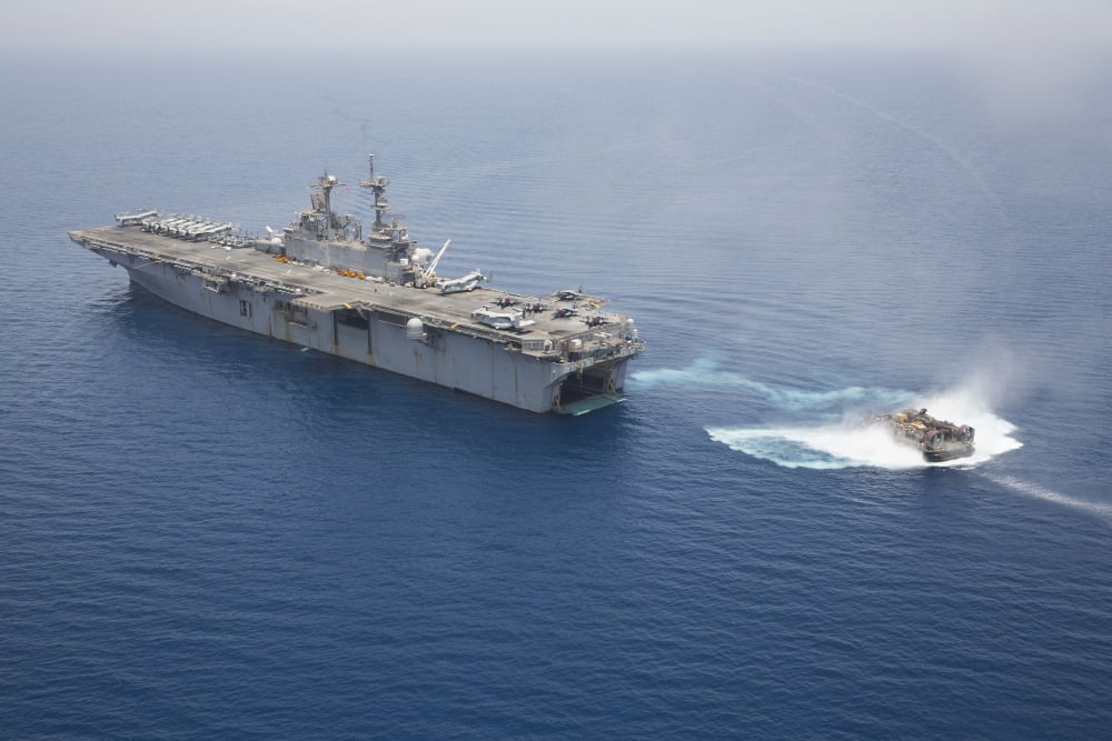 A landing craft air cushion approaches the well deck of USS Kearsarge Canvas Art - Stocktrek Images (35 x 23)