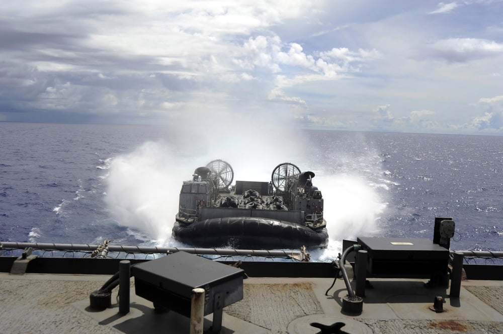 A landing craft air cushion prepares to enter the well-deck of USS Harpers Ferry Canvas Art - Stocktrek Images (34 x 23)