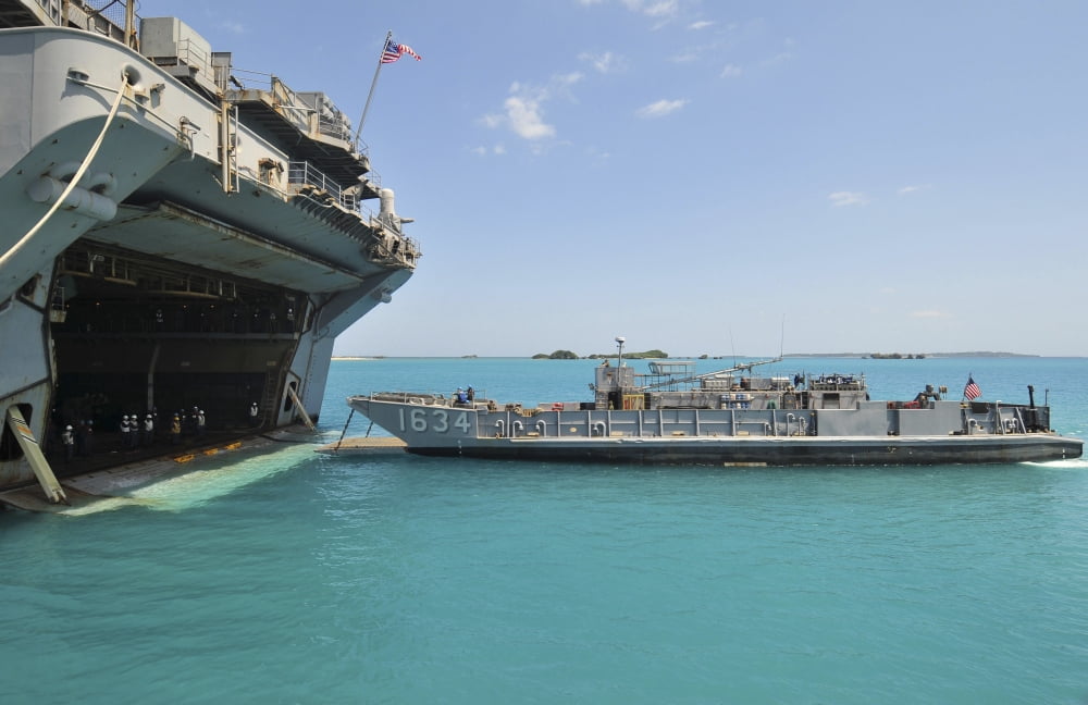 A landing craft utility approaches the well deck of USS Essex Canvas Art - Stocktrek Images (35 x 23)