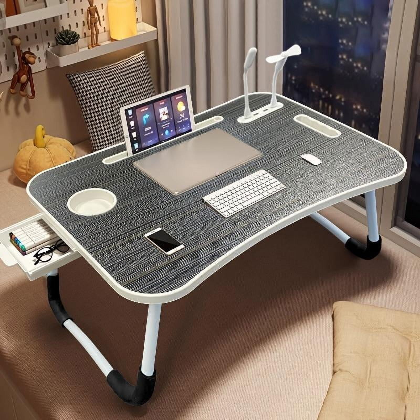 A laptop bed desk, which is portable and foldable, comes with slots, a ...