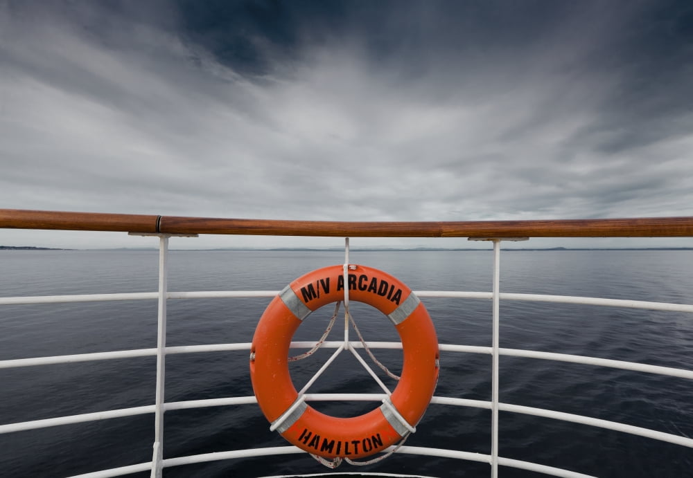 A life preserver hanging from the railing on a boat Norway Canvas Art - Terence Waeland Design Pics (18 x 12)