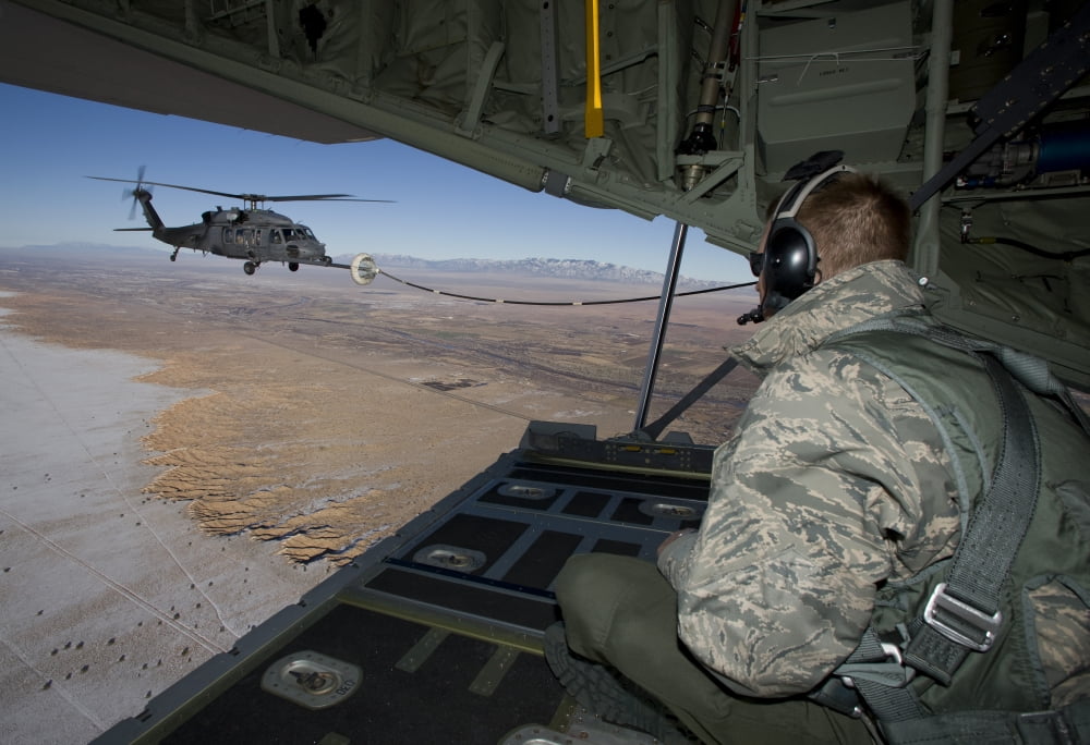A loadmaster on an HC-130 watches as an HH-60G Pave Hawk refuels Canvas Art - HIGH-G ProductionsStocktrek Images (18 x 12)