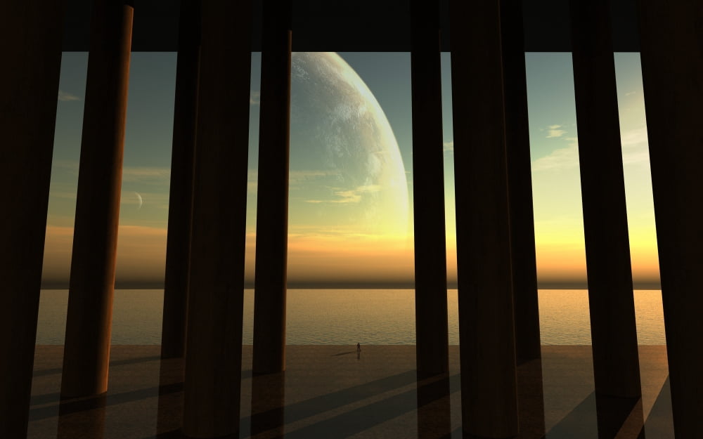 A lonesome explorer stands on the edge of an ocean looking at a giant moon in the alien sky Canvas Art - Frieso HoevelkampStocktrek Images (18 x 12)