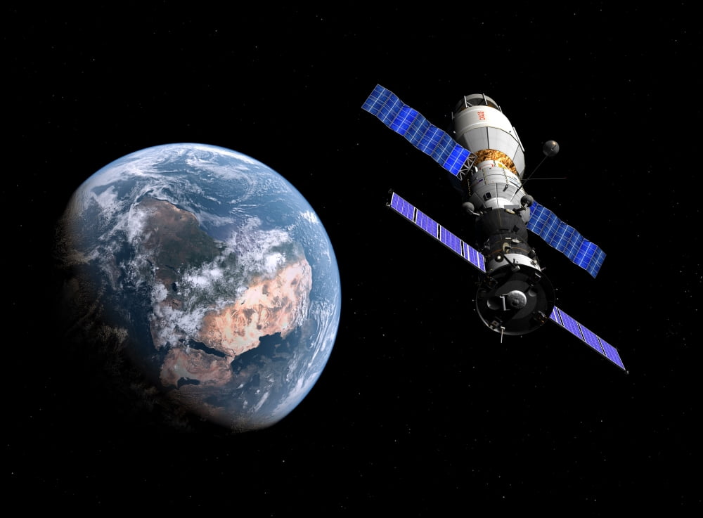 A manned Soyuz TMA-M spacecraft docked with an extended stay module Canvas Art - Walter MyersStocktrek Images (17 x 12)