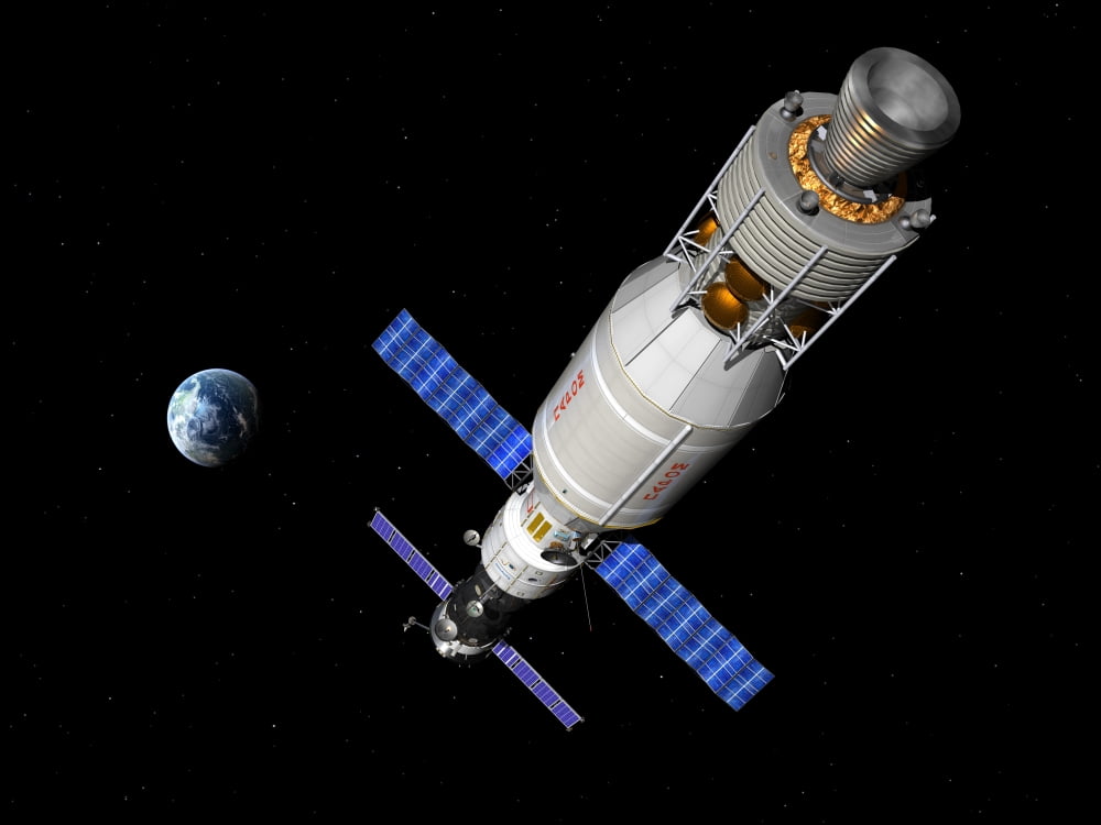 A manned Soyuz TMA-M spacecraft docked with an extended stay module Canvas Art - Walter MyersStocktrek Images (17 x 13)
