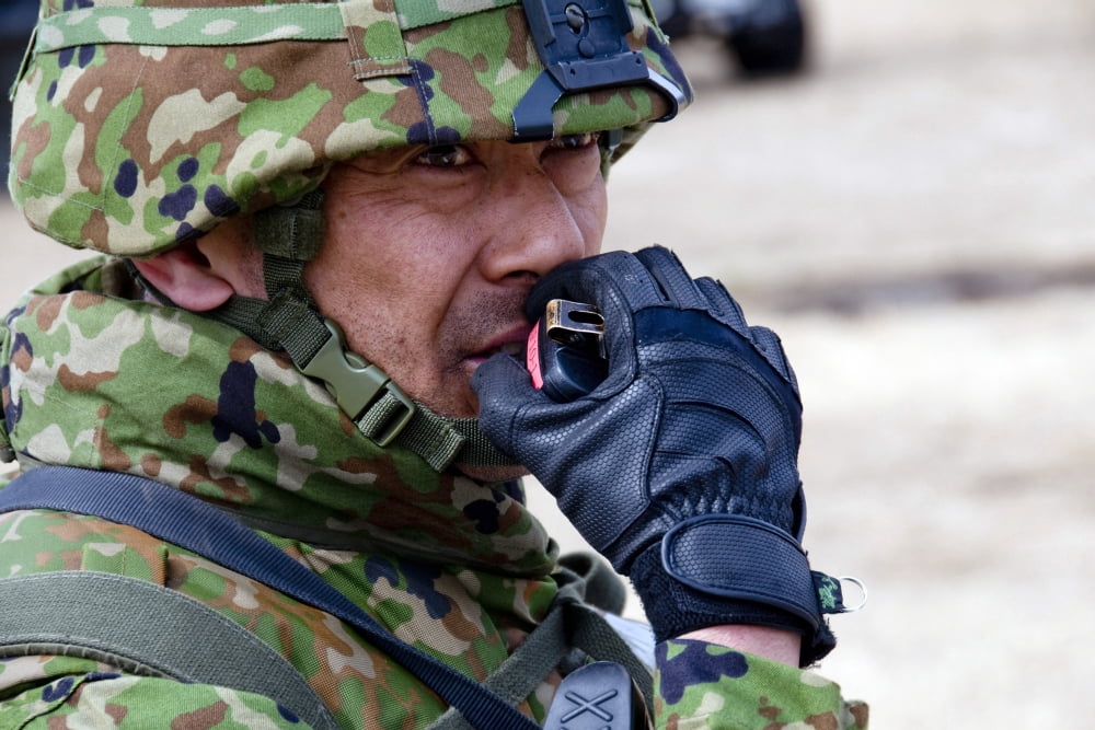 A member of the Japan Ground Self-Defense Force relays instructions to his troops over a radio Canvas Art - Stocktrek Images (34 x 23)