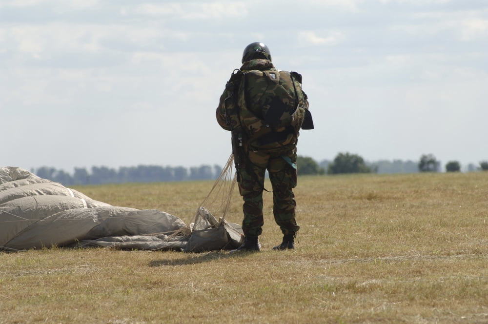 A member of the Pathfinder Platoon collapses his parachute after a HALO jump Canvas Art - Andrew ChittockStocktrek Images (34 x 23)