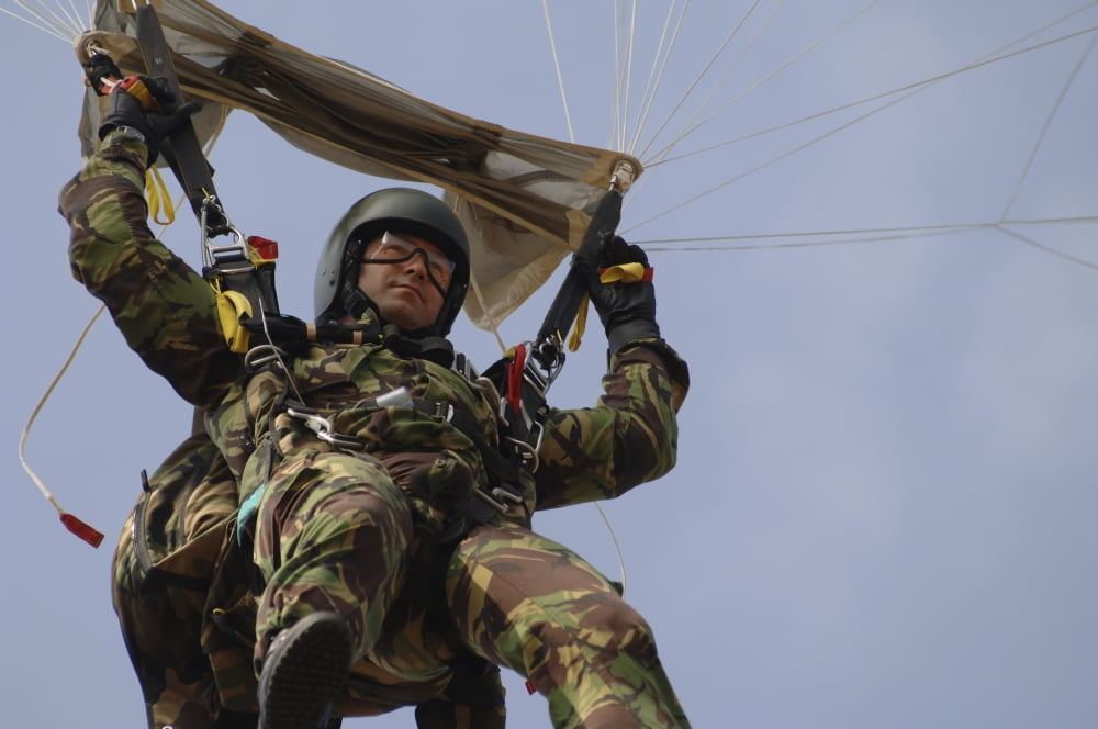 A member of the Pathfinder Platoon prepares to land from a parachute jump Canvas Art - Andrew ChittockStocktrek Images (17 x 12)