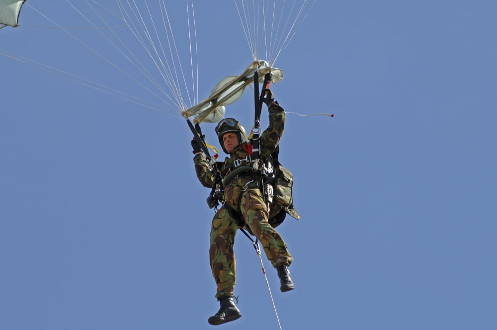 A member of the Pathfinder Platoon prepares to land from a parachute jump Canvas Art - Andrew ChittockStocktrek Images (17 x 12)