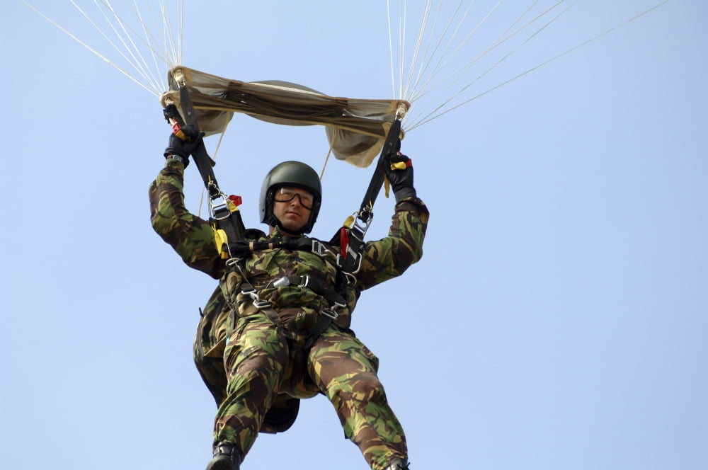 A member of the Pathfinder Platoon prepares to land from a parachute jump Canvas Art - Andrew ChittockStocktrek Images (17 x 12)