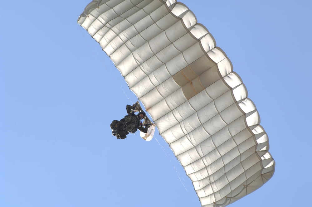 A member of the Pathfinder Platoon prepares to land from a parachute jump Canvas Art - Andrew ChittockStocktrek Images (34 x 23)