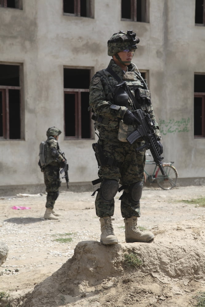 A member of the Republic of Korea Provincial Reconstruction Team provides security in Afghanistan Canvas Art - Stocktrek Images (23 x 34)