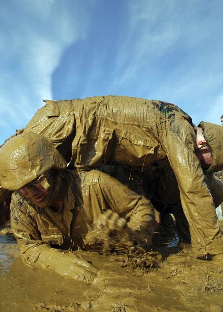 A midshipman crawls through fellow plebes in an obstacle course Canvas Art - Stocktrek Images (24 x 34)