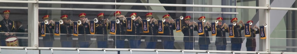 A military band of trumpeters performs on the balcony of the Clinton Presidential Library Former US President Bill Clinton will officiate the opening of his presidential library November 18 2004 in Li