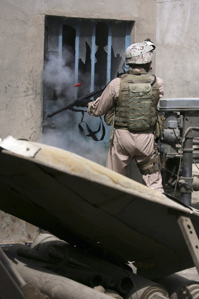 A military policeman uses a breaching round to open a lock Canvas Art - Stocktrek Images (23 x 34)