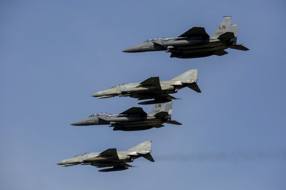 A mixed formation of US Air Force F-15E Strike Eagles and Hellenic Air Force F-4E Phantoms Canvas Art - Timm ZiegenthalerStocktrek Images (17 x 12)