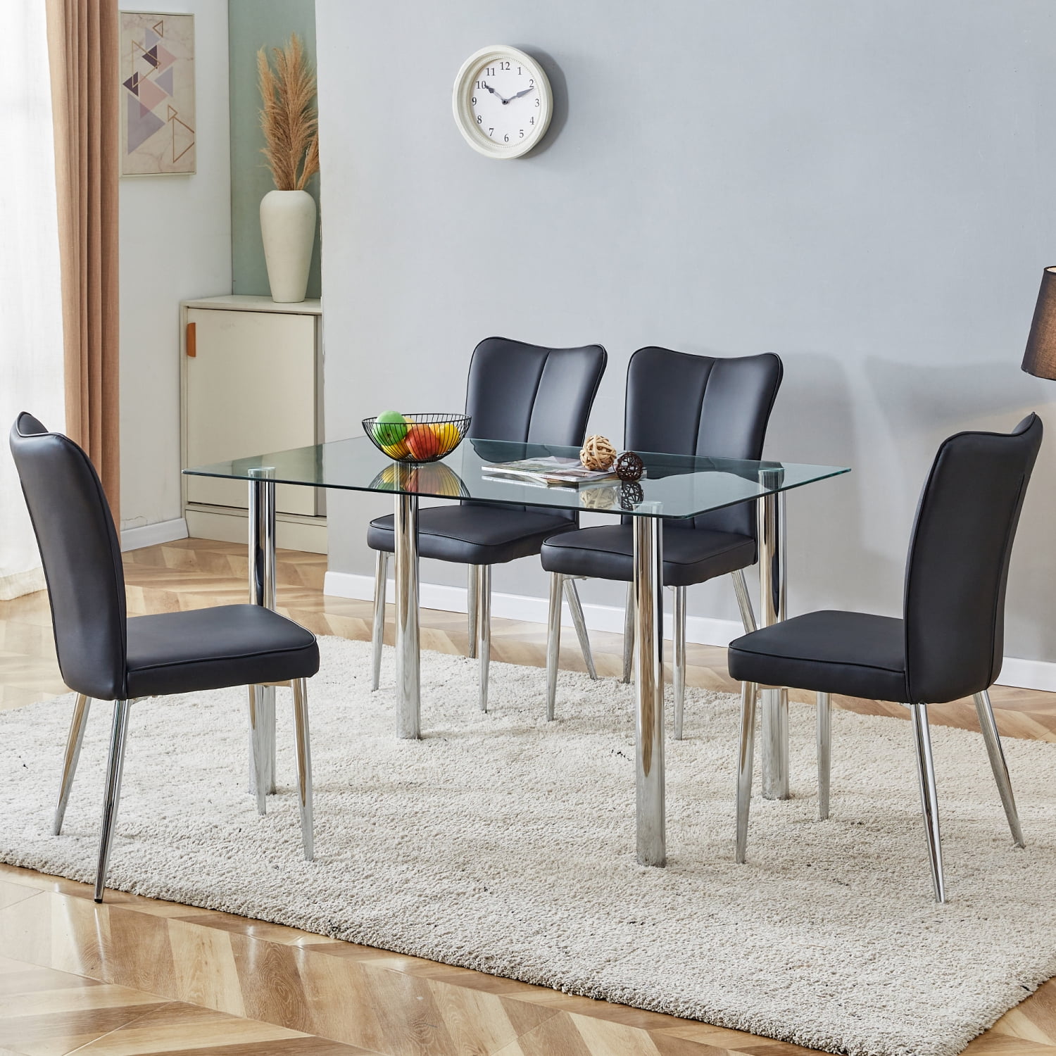 View of A modern minimalist style glass dining table. Transparent tempered ...