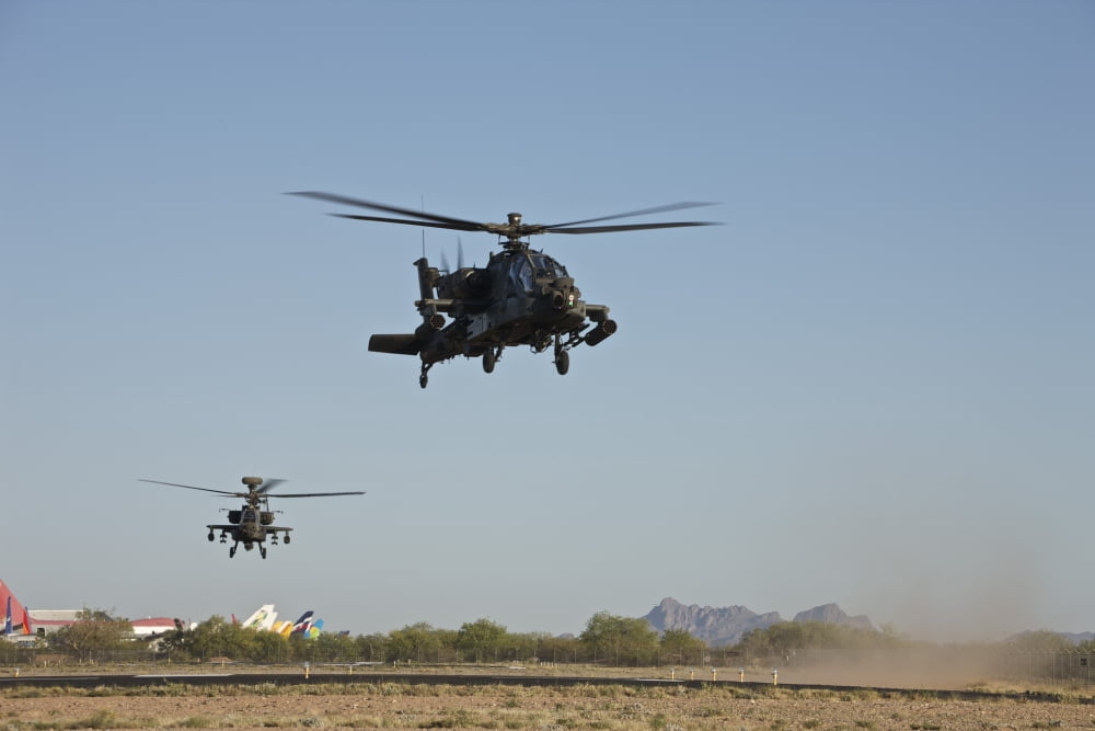 A pair of AH-64D Apache Longbow helicopters taking off Canvas Art - Terry MooreStocktrek Images (35 x 23)