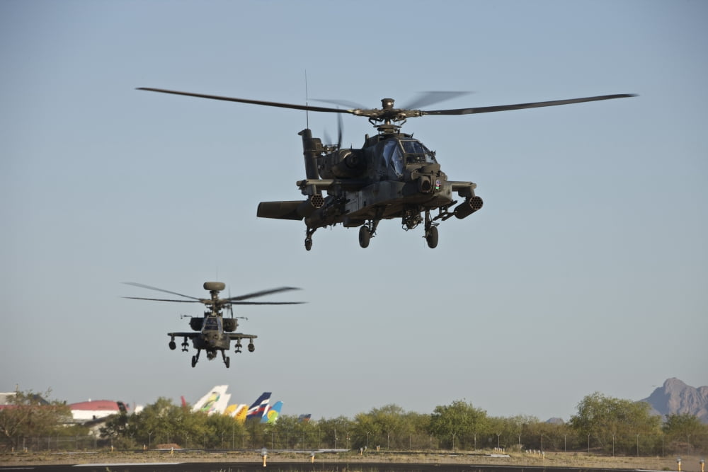 A pair of AH-64D Apache Longbow helicopters taking off Canvas Art - Terry MooreStocktrek Images (35 x 23)