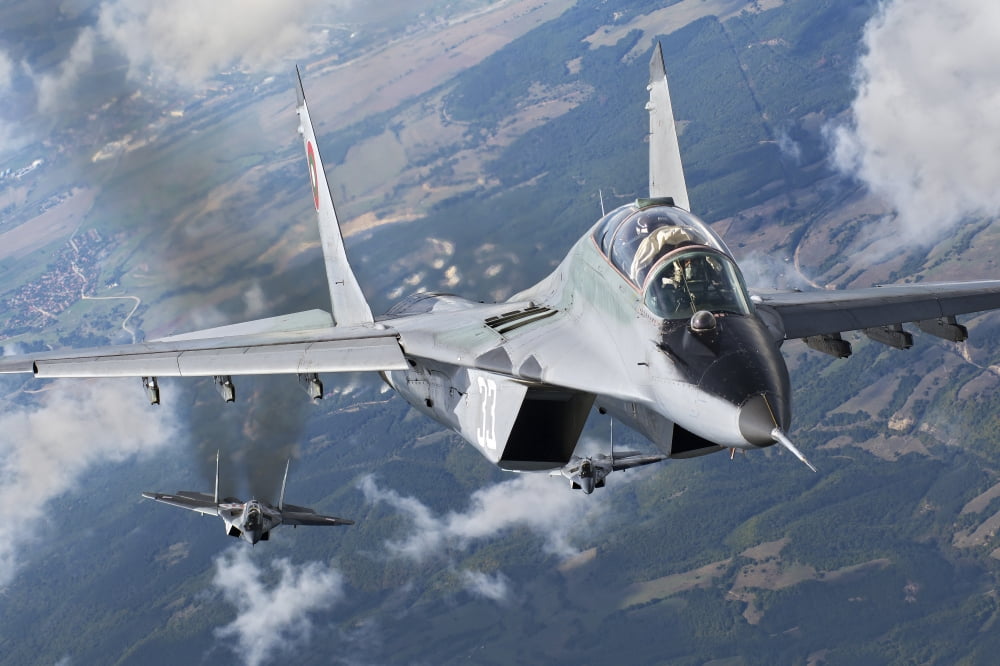 A pair of Bulgarian Air Force MiG-29s aircraft over Bulgaria Canvas Art - Daniele FaccioliStocktrek Images (34 x 23)
