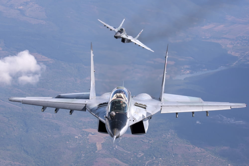 A pair of Bulgarian Air Force MiG-29s aircraft over Bulgaria Canvas Art - Daniele FaccioliStocktrek Images (34 x 23)
