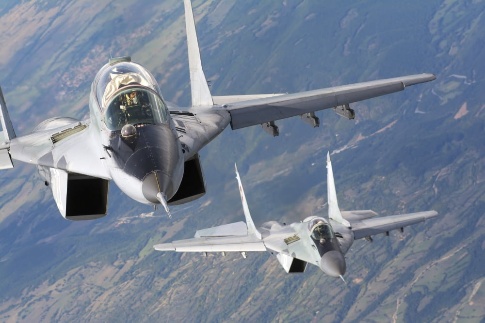 A pair of Bulgarian Air Force MiG-29s aircraft over Bulgaria Canvas Art - Daniele FaccioliStocktrek Images (34 x 23)